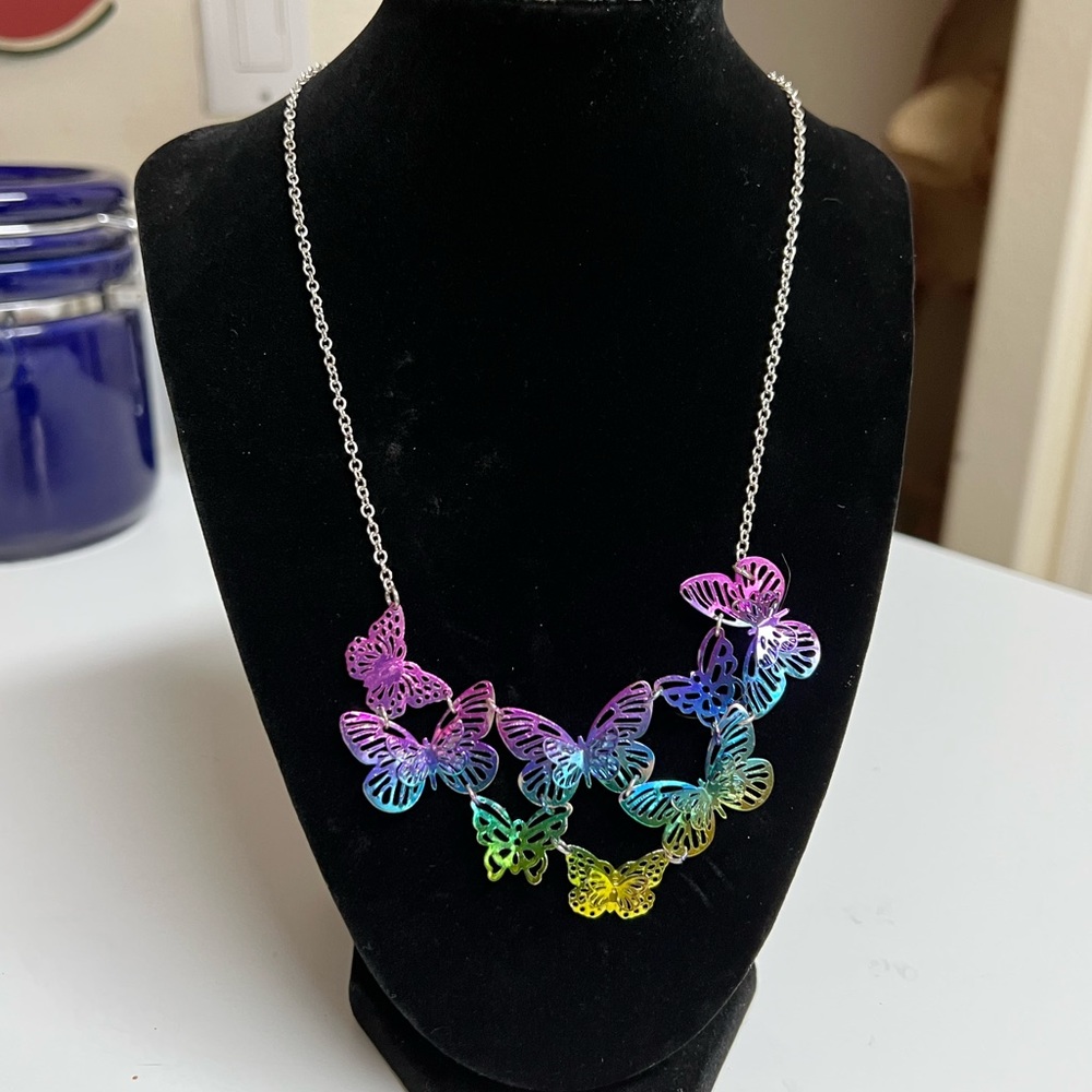 Beautifully Multiple Colored Butterfly Necklace with a 16" Silver Color Chain.